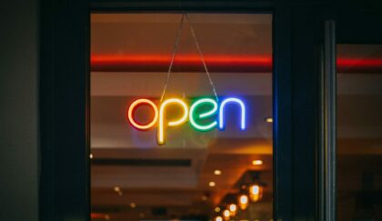 rainbow colored neon open sign