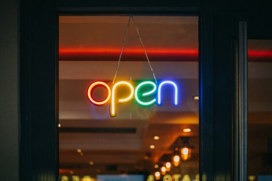 rainbow colored neon open sign